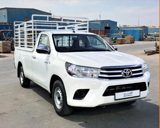White 1-ton single-cab pickup with a rail-sided cargo bed